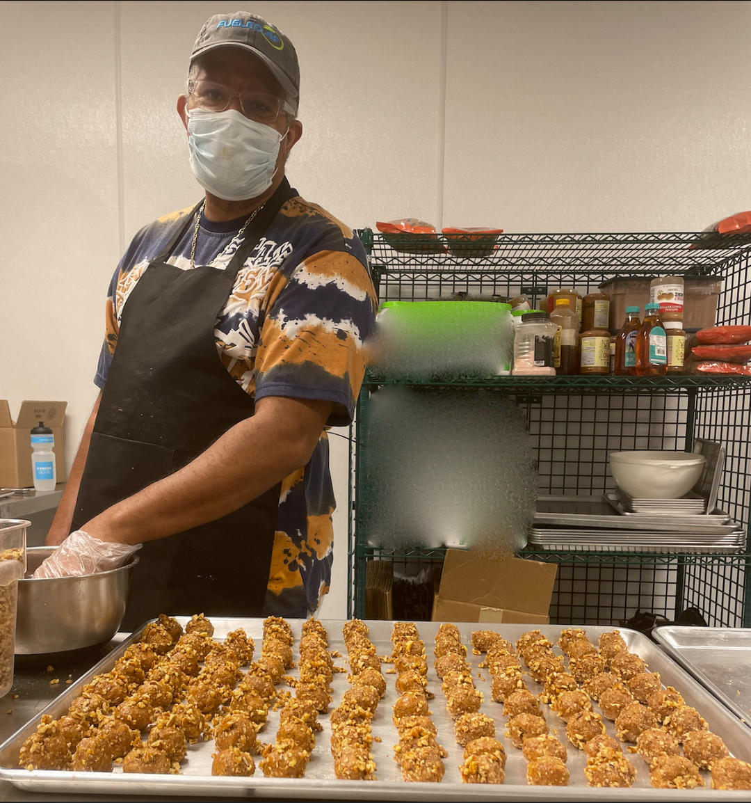 Fueled by AF worker making protein bites in the kitchen